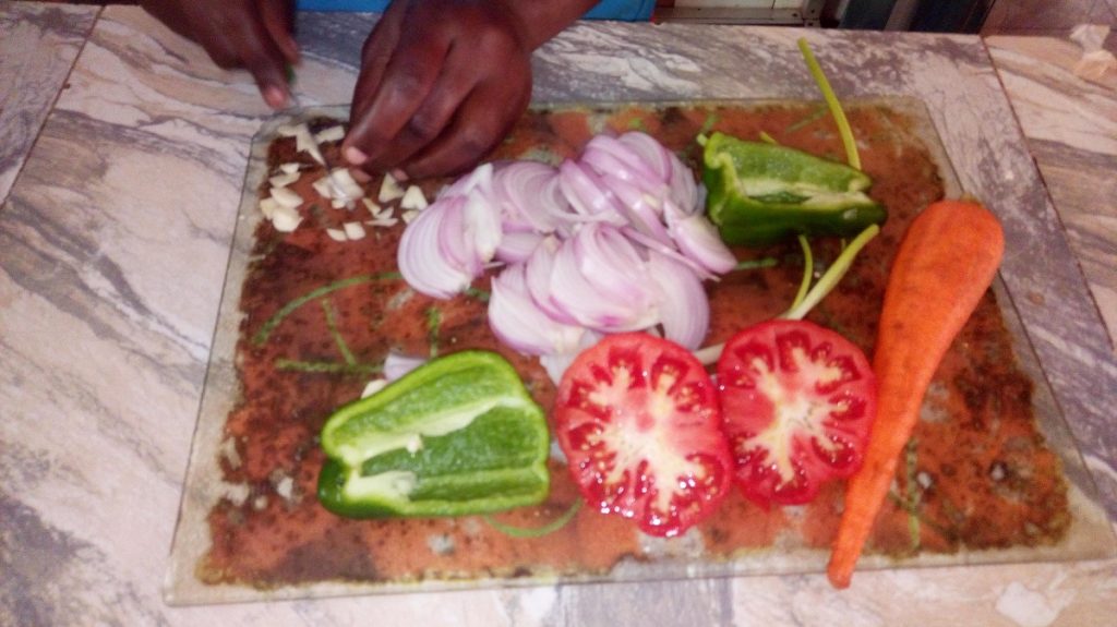 food in Ghana, vegetables on a chopping board